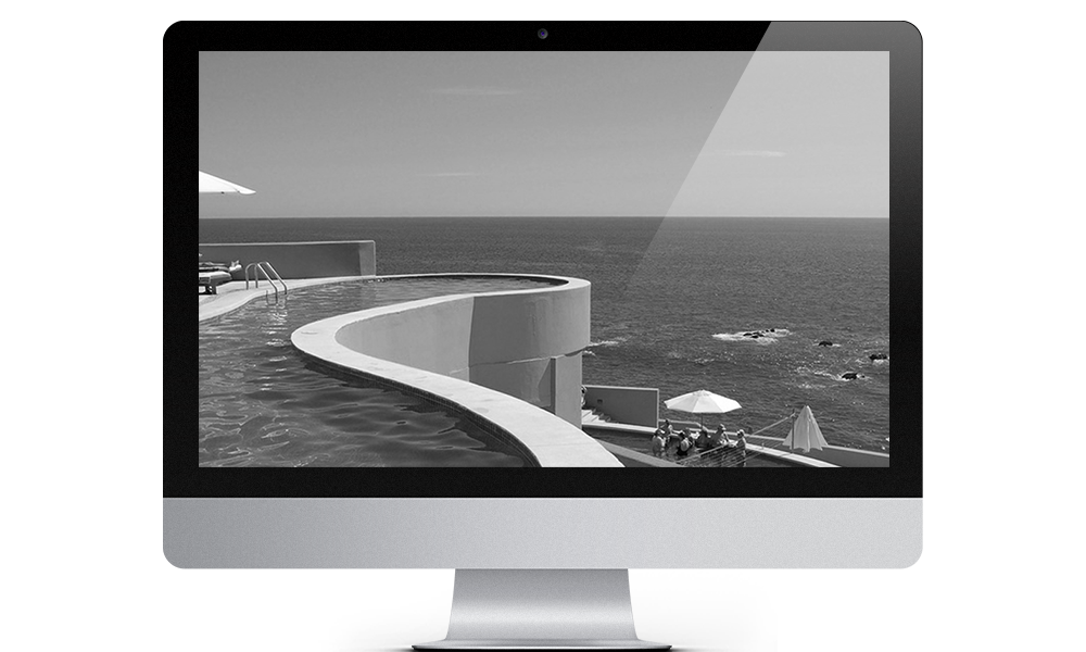 a black and white of a beachfront pool shown on a computer screen