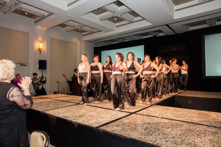 a group of women dressed in bras and drawstring pants on a fashion runway
